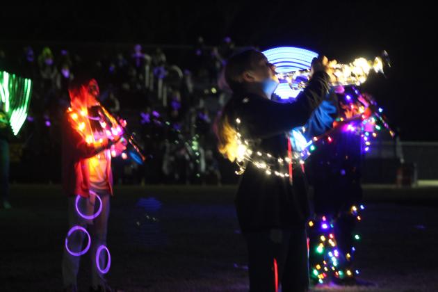 Tecumseh's Savage Pride Marching Band performs their annual light show as they play music from "Aladdin" during halftime of the home game on Oct. 28. Due to rain, they almost didn't play their instruments and would've moved to a recording, but it let up to a sprinkle and allowed them to play. Countywide &amp; Sun/Natasha Dunagan