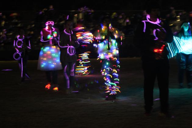 Tecumseh's Savage Pride Marching Band performs their annual light show as they play music from "Aladdin" during halftime of the home game on Oct. 28. Due to rain, they almost didn't play their instruments and would've moved to a recording, but it let up to a sprinkle and allowed them to play. Countywide &amp; Sun/Natasha Dunagan