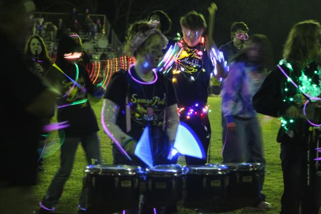 Laycee Thoma performs with the Tecumseh Drum Line after the Savage Pride Marching Band's annual light show at half time of the home game on Oct. 28. Countywide &amp; Sun/Natasha Dunagan