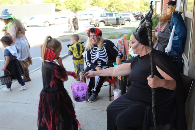 Julie Talton and Suzie Campbell hand out candy at the "Countywide &amp; Sun" office on Oct. 31. Countywide &amp; Sun/Natasha Dunagan