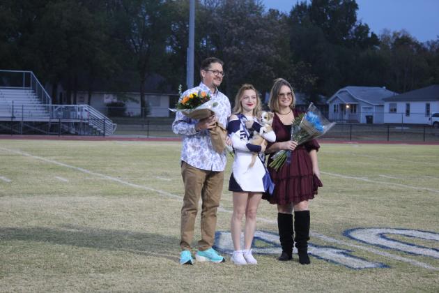 Shawnee pom squad member Berlin Garlow, her parents and her puppy pose during Shawnee High School's Senior Night ceremonies on Thurs., Nov. 3. There were 46 seniors honored in cross country, football, band, color guard, choir, cheer and pom. Countywide &amp; Sun/Natasha Dunagan