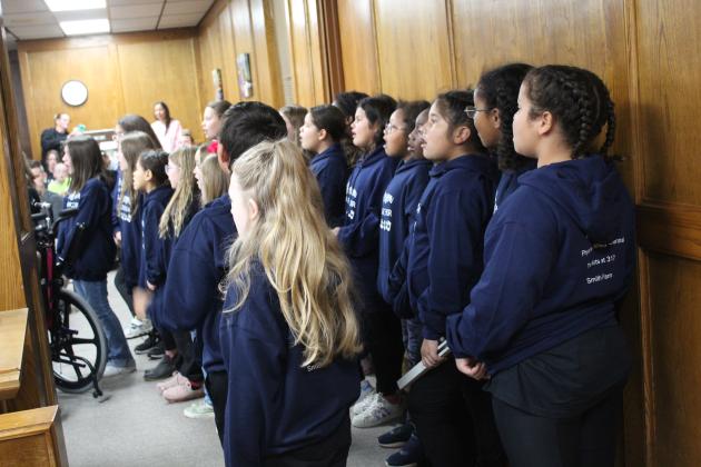 The Jefferson Honor Choir, led by Teresa Swadley, perform for the Shawnee Board of Education at their meeting on Nov. 7. Countywide &amp; Sun/Natasha Dunagan