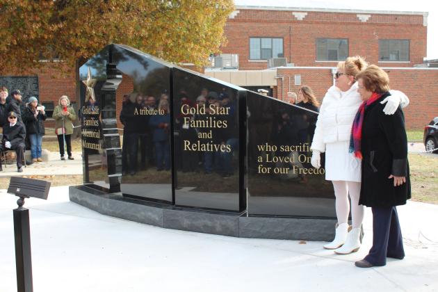 Gold Star Family members Donna Warren and Nancy Ford stand by the Gold Star Families Memorial Monument after unveiling it in Woodland Veterans Park on Nov. 11. Countywide &amp; Sun/Natasha Dunagan