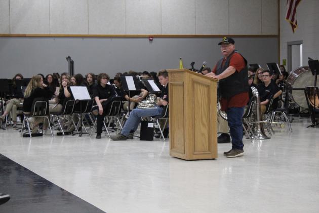 Veteran Darrell Hinson speaks about the origin of "Taps" during the Tecumseh High School Veterans Day Program on Nov. 11. Countywide &amp; Sun/Natasha Dunagan
