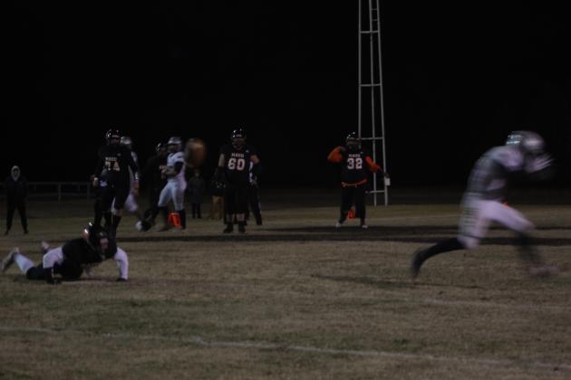 Maud sophomore Jesse Siqueiros attempts a pass, but neither his teammate nor the Timberlake player who tried to intercept caught the ball in the Class C OSSAA Quarterfinal home game against Timberlake on Nov. 18. After winning 11 straight games, the Maud Tigers lost to the Timberlake Tigers, 24-64. Countywide &amp; Sun/Natasha Dunagan