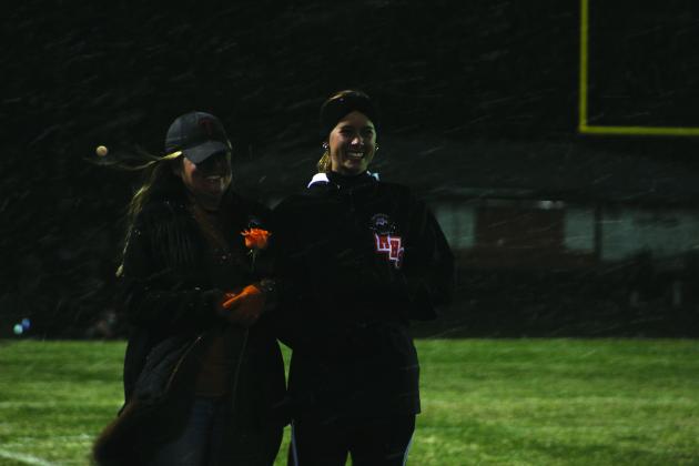 Maud senior cheerleader Aubrey Williams and her mother Amber Williams smile after trying to catch snowflakes in their mouths during Senior Night, following the Class C first-round play-off game against Oaks Mission on Nov. 11. Maud won their 11th straight game, and it was called at half time, 60-8. Countywide &amp; Sun/Natasha Dunagan