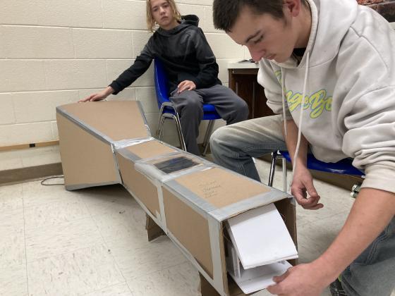Shawnee freshmen Jeremy Begley and Sean Barksdale, Jr. test an airfoil in the wind tunnel they made in "Launching Into Aviation" class last week. Shawnee High School added the AOPA "You Can Fly" aerospace curriculum this year. Photo provided by Joshua Watson.