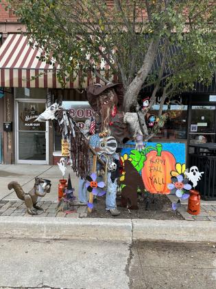 The Make It Yours cowboy scarecrow, at 115 N. Broadway, won third place in the City of Tecumseh Commercial Scarecrow Contest. Photo provided.