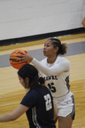 Shawnee's Tristyn Napier aims a free throw during the third quarter of the home game against El Reno on Nov. 29. The Lady Wolves lost 28-42. The Wolves also lost that night, 31-45. Countywide &amp; Sun/Natasha Dunagan