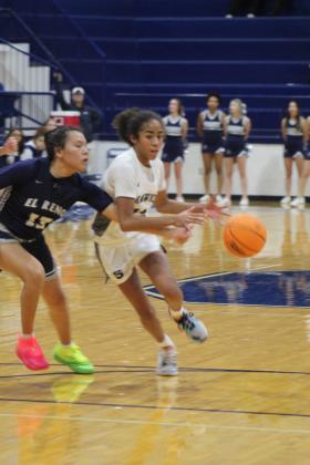 Shawnee's Tarilyn Thierry has the ball knocked away from her during the second quarter of the home game against El Reno on Nov. 29. The Lady Wolves lost 28-42. The Wolves also lost that night, 31-45. Countywide &amp; Sun/Natasha Dunagan