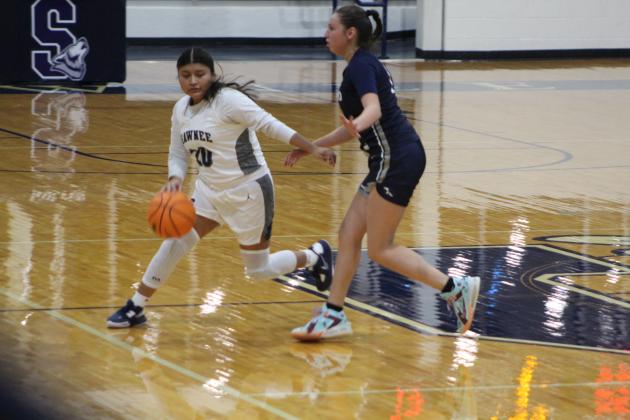Shawnee's Tylyn Thurman dribbles toward the paint during the second quarter of the home game against El Reno on Nov. 29. The Lady Wolves lost 28-42. The Wolves also lost that night, 31-45. Countywide &amp; Sun/Natasha Dunagan