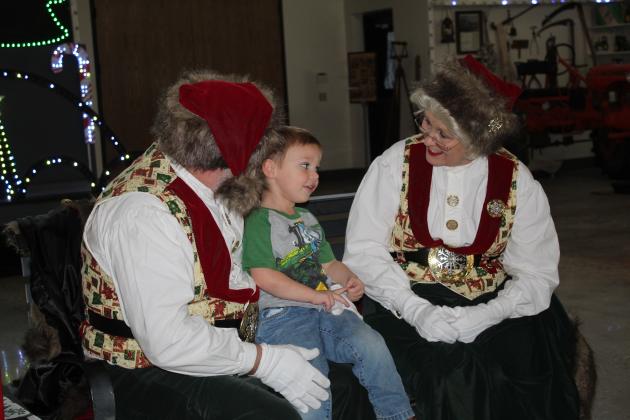 Bryson Osborn, 3, of Konawa, talks with Santa and Mrs. Claus at the Paul and Ann Milburn Center on Dec. 3.  Santa will return to the Pottawatomie County history museum on Dec. 10, 1-4 pm. There will be no admission that day. An indoor light show can also be seen before Dec. 24. Countywide &amp; Sun/Natasha Dunagan