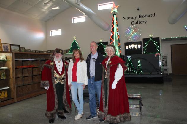 Nancy and Jim Antosh pose with Santa and Mrs. Claus at the Paul and Ann Milburn Center on Dec. 3. Nancy Antosh is the daughter of the late Virginia Bradshaw, who wrote for the Countywide &amp; Sun for many years. Countywide &amp; Sun/Natasha Dunagan