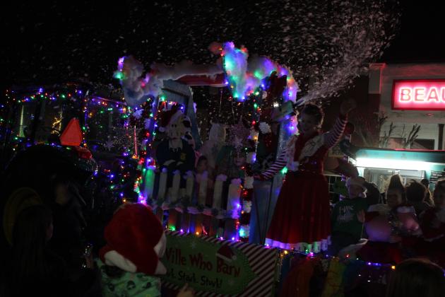 The Tecumseh 4H-FFA Booster Club float was pulled by a tractor and produced snow from its roof for the Grinchmas Holiday Parade and Marching Band Contest in Tecumseh on Dec. 8. They won first place. Countywide &amp; Sun/Natasha Dunagan