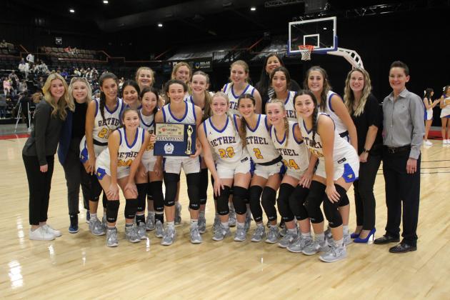 The Bethel Lady Wildcats and their coaches pose with their Bethel First United Basketball Tournament Champion Trophy on Dec. 10 at FireLake Arena. Over the three-day event, the Lady Wildcats won all three of their games, beating U.S. Grant, 63-19, Byng, 56-41, and Tecumseh, 63-33, to take the girls side of the tournament. Countywide &amp; Sun/Natasha Dunagan