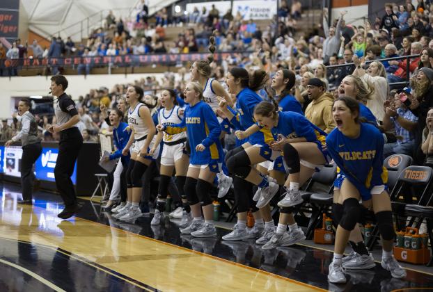 The Bethel Lady Wildcats on the sidelines and the fans react to the game against Caddo during the Bertha Frank Teague Mid-America Classic on Dec. 30. The Lady Wildcats won their first two games with Georgetown, TX, 53-41, and Ada, 53-37, but they lost by one point, 40-41, with Caddo. Josie Megehee and Parker Stevenson made the All-Tournament Team. Photo provided by Richelle Treece.