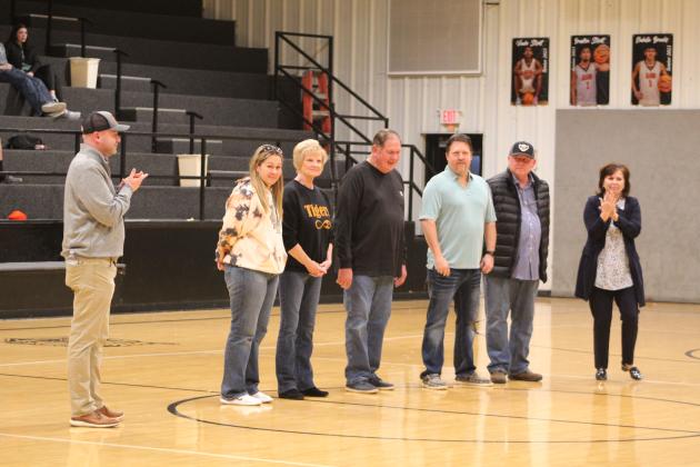As part of School Board Recognition Month in January, the Maud Public Schools Board of Education was applauded for their efforts during halftime of the Lady Tigers home game on Jan. 12. Shown, from left, are Maud Middle School/High School Principal Stephen Harris, Michelle Watson, Carolyn Bassett, Glen Williams, Kurtis Dustman, Barry Fletcher, and Superintendent Cindy White. Countywide &amp; Sun/Natasha Dunagan