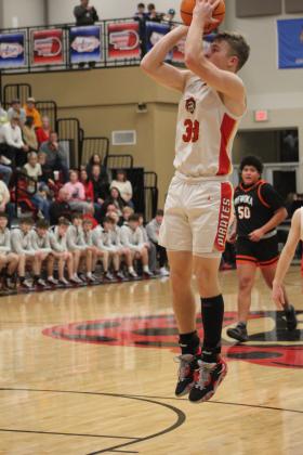 Dale's Dayton Forsythe makes his jump shot in the first quarter of the homecoming game against Wewoka on Jan. 13. The Pirates won 85-25 and have a record of 19-0. Countywide &amp; Sun/Natasha Dunagan