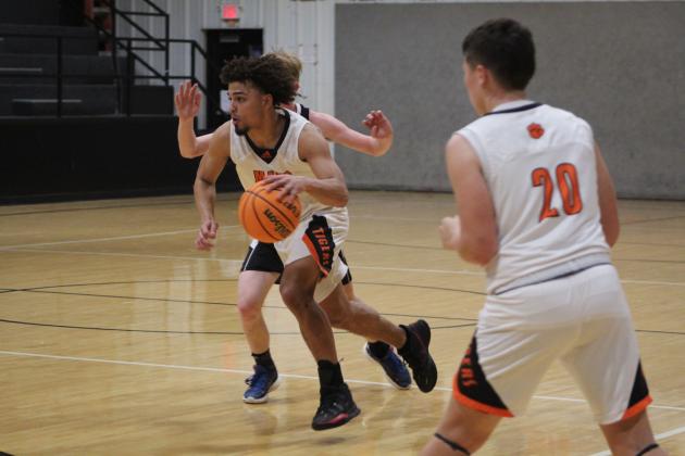 Maud's Braxton Street drives to the basket and makes two points during the second quarter of the home game against Calvin on Jan. 12. The Maud Tigers won 63-48, and their record is 13-2.  Countywide &amp; Sun/Natasha Dunagan
