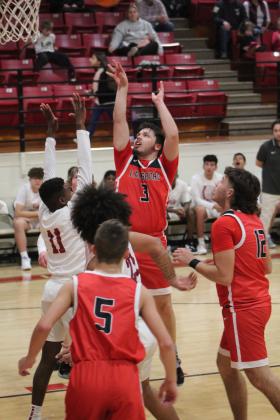 Earlsboro's Justin McGehee gets the rebound and tries for the basket in the game with Wynnewood, Jan. 5, during the Jim Walling Classic. The Wildcats lost this game, 46-51, but won their next two games with Olive, 63-46, and Wilson (Henryetta), 67-46, to become the Consolation Champions. Countywide &amp; Sun/Natasha Dunagan
