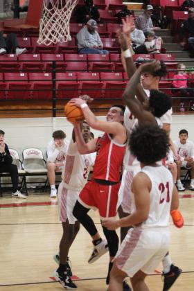 Earlsboro's Trent Deere tries for two points in the game with Wynnewood, Jan. 5, during the Jim Walling Classic. The Wildcats lost this game, 46-51, but won their next two games with Olive, 63-46, and Wilson (Henryetta), 67-46, to become the Consolation Champions. Countywide &amp; Sun/Natasha Dunagan