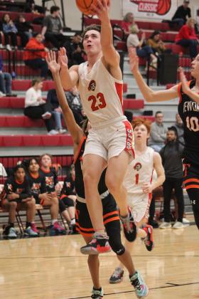 Dale's Deken Jones puts up a shot in the first quarter of the homecoming game against Wewoka on Jan. 13. The Pirates won 85-25 and have a record of 19-0. Countywide &amp; Sun/Natasha Dunagan