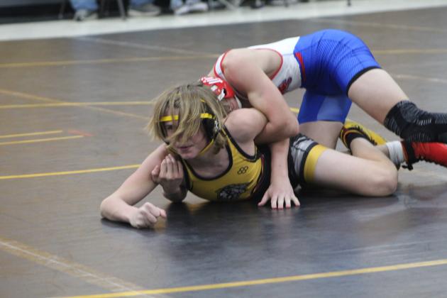 Tecumseh's Carter Hadsall concentrates on holding his ground during the meet with Chandler at the Alumni Center on Dec. 15. The Savages won 36-31. Countywide &amp; Sun/Natasha Dunagan