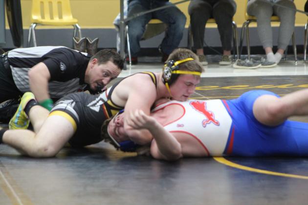 Tecumseh's Hunter Hadsall gets a pin in his exhibition match against a Chandler opponent at the Alumni Center on Dec. 15. The Savages won 36-31. Countywide &amp; Sun/Natasha Dunagan