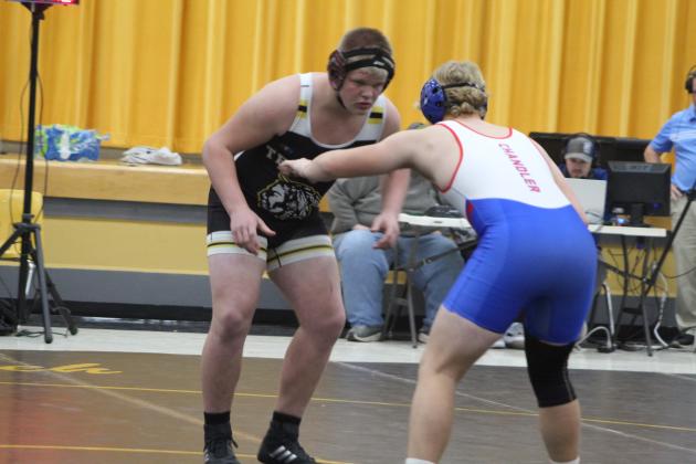 Tecumseh's Dominick Frizell circles his Chandler opponent during the meet at the Alumni Center on Dec. 15. The Savages won 36-31. Countywide &amp; Sun/Natasha Dunagan
