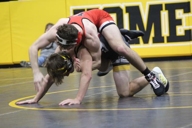 In the 132-pound class, McLoud's Kaiden Cue tries to knock the arm from under Tecumseh's Xavier Kommer during the homecoming dual meet on Jan. 10 at the Tecumseh Middle School Gym. The McLoud Redskins won 38-33, and the Lady Redskins won 48-24  Countywide &amp; Sun/Natasha Dunagan
