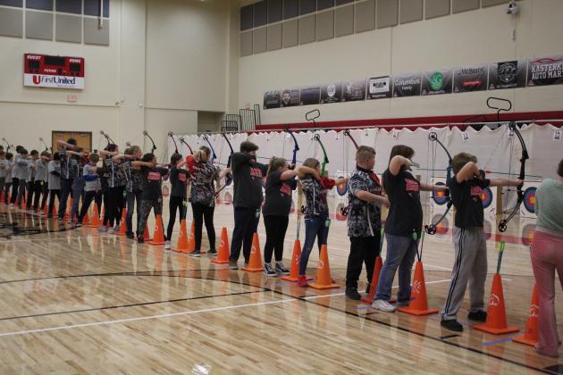 The second flight of up to 48 archers aim and shoot compound bows. About 600 students from 25 Oklahoma schools participated in the NASP Tournament, held at North Rock Creek Middle School Gym, Jan. 13-14. Countywide &amp; Sun/Natasha Dunagan