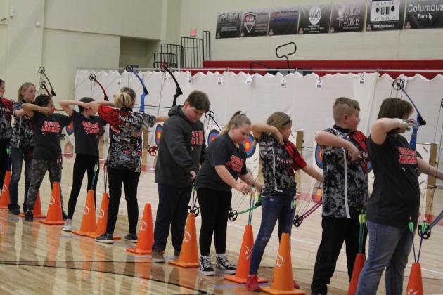 The second flight of up to 48 archers aim and shoot compound bows. About 600 students from 25 Oklahoma schools participated in the NASP Tournament, held at North Rock Creek Middle School Gym, Jan. 13-14. Countywide &amp; Sun/Natasha Dunagan
