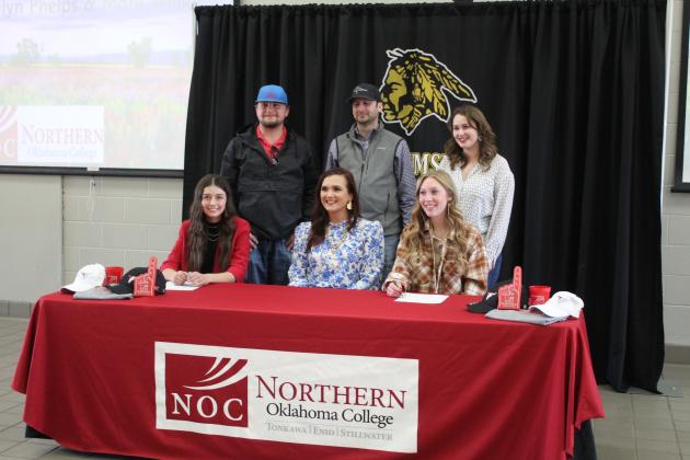Jocelyn Phelps and Marli Williams sign with NOC for livestock judging. Also shown are, standing, FFA Advisors Corey Pell, Dodge Nichols and Mara Carman, and NOC Livestock Judging Coach and Professor Jennifer Bedwell, seated center.