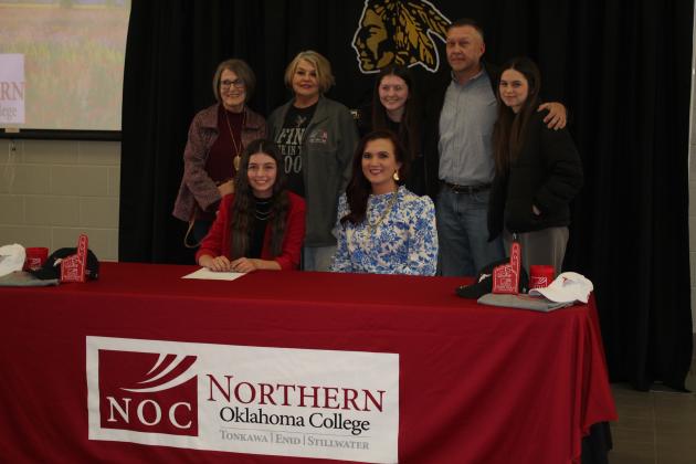 Jocelyn Phelps poses with her family and NOC Livestock Judging Coach and Professor Jennifer Bedwell, seated right.
