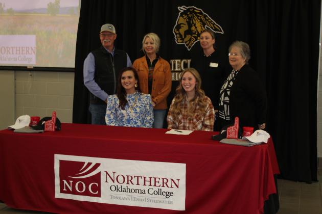 Marli Williams poses with her family and NOC Livestock Judging Coach and Professor Jennifer Bedwell, seated left.