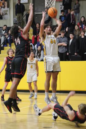 Tecumseh junior Keegan Plumley goes up for a basket in the second quarter of the Class 4A District game against Crossings Christian on Feb. 17. The Savages lost 67-84. Countywide &amp; Sun/Natasha Dunagan