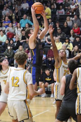 Bethel's Bronc Robbins makes his shot in the first quarter of the game at Tecumseh on Feb. 3. The Wildcats won, 61-70. Countywide &amp; Sun/Natasha Dunagan