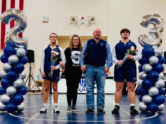 Shawnee seniors Sawyer Cash, far left, and Logan Cash pose with their parents during Wrestling Senior Night on Feb. 7. Photo provided by Michelle Sisson.