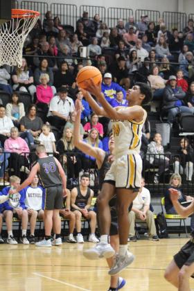 Tecumseh's Jace Edwards goes up for a basket in the second quarter of the homecoming game against Bethel on Feb. 3. The Savages lost, 61-70. Countywide &amp; Sun/Natasha Dunagan