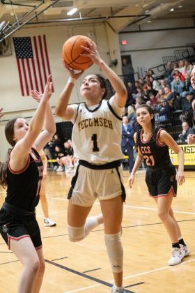 Tecumseh junior Serenity Jacoway puts up a shot during the Class 4A District game against Crossings Christian on Feb. 17. The Lady Savages won, 79-26, to become district champions. Photo provided by Kenetta Lisenbee.