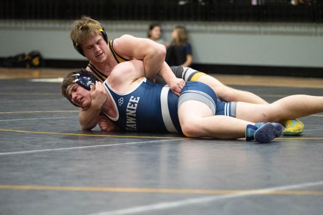 Tecumseh senior Hunter Hadsall tries to flip Shawnee senior Trevor Thomason in the Tecumseh match on Feb. 9. The Wolves won 55-20. Photo provided by Kenetta Lisenbee.