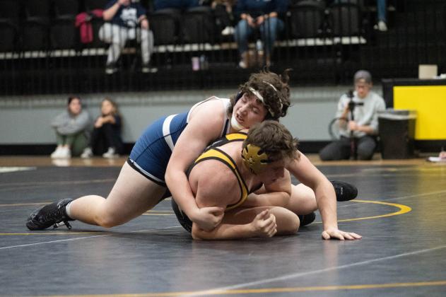 Shawnee senior Beau Skelton counters Tecumseh's Jacob Frazier in the Tecumseh match on Feb. 9. The Wolves won 55-20. Photo provided by Kenetta Lisenbee.