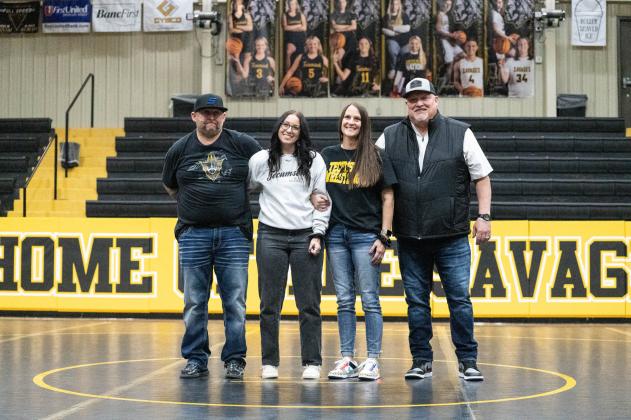Tecumseh senior Josie Hilton poses with her family during Wrestling Senior Night on Feb. 9. Photo provided by Kenetta Lisenbee.