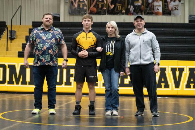 Tecumseh senior Jace Frazier poses with his family during Wrestling Senior Night ceremonies on Feb. 9. Photo provided by Kenetta Lisenbee.