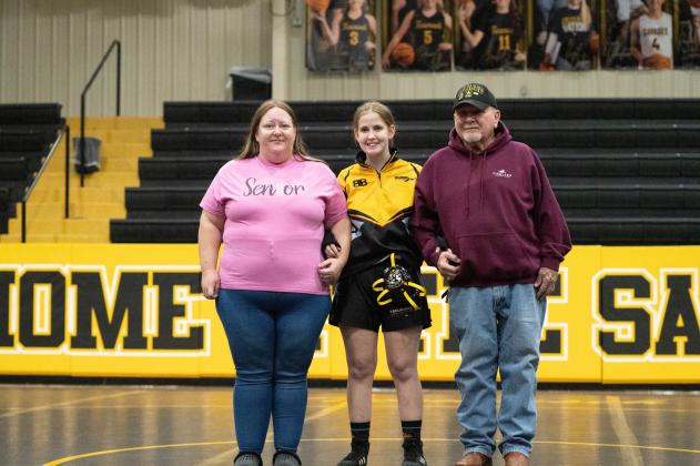 Tecumseh senior Makayla Partain poses with her family during Wrestling Senior Night ceremonies on Feb. 9. Photo provided by Kenetta Lisenbee.