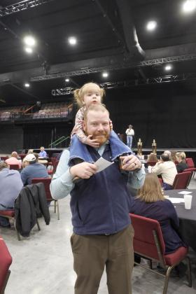 Bid spotter Trent Boles has an extra pair of eyes helping him watch the crowd during the live auction at the PCJLS Trophy Auction. Countywide &amp; Sun/Suzie Campbell