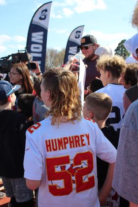 Kansas City Chiefs Center Creed Humphrey signs autographs for the crowd of Little League football players and others after leaving the stage at the Creed Humphrey Day Celebration at Shawnee High School on March 4. Countywide &amp; Sun/Natasha Dunagan