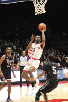 Potawatomi Fire Guard/Forward Theo Johnson tries for a jump shot and is fouled during the first home game of the second season, March 17, at FireLake Arena. The Fire won against the Rockwall 7'ers, 152-96. Countywide &amp; Sun/Natasha Dunagan