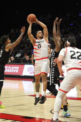 Potawatomi Fire Guard Deshawn Munson concentrates on hitting his shot in the second quarter of their first home game of the season, March 17, at FireLake Arena. The Fire won against the Rockwall 7'ers, 152-96. Countywide &amp; Sun/Natasha Dunagan