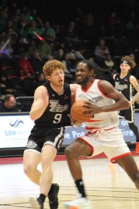 Potawatomi Fire Guard/Forward Theo Johnson drives to the hoop during the first home game of the second season, March 17, at FireLake Arena. The Fire won against the Rockwall 7'ers, 152-96. Countywide &amp; Sun/Natasha Dunagan